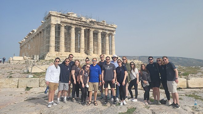 Students pose in front of Parthenon