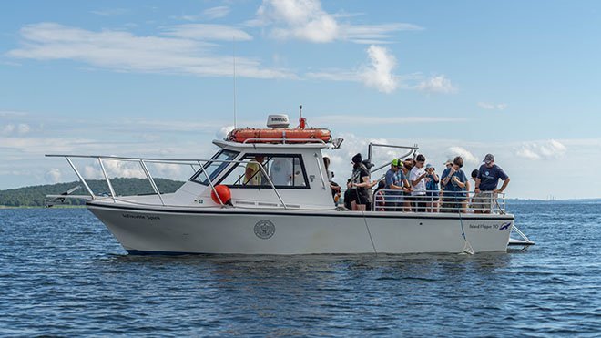 A group of high school students on the InVinceble Spirit research vessel as part of RWU's Marine Biology camp