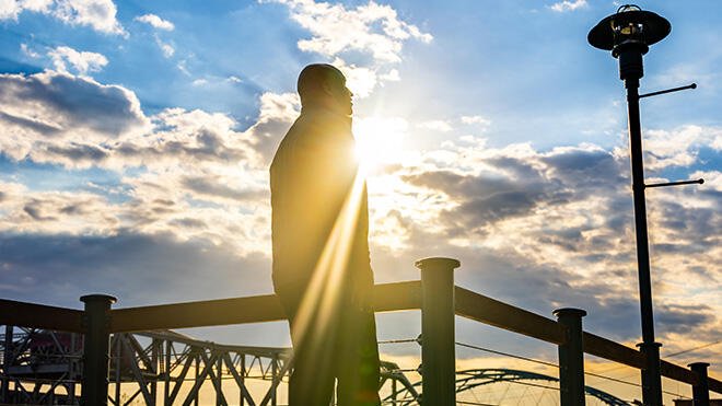 Meko Lincoln's silhouette against a cloudy sky