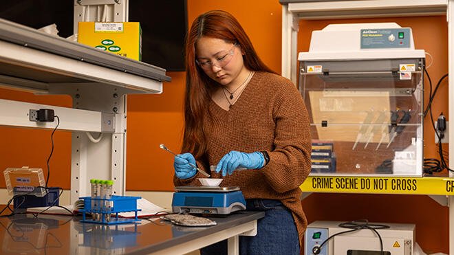 Paige Morris working in the Forensics lab.
