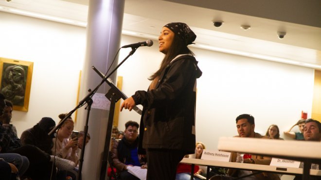 Student performs at microphone.
