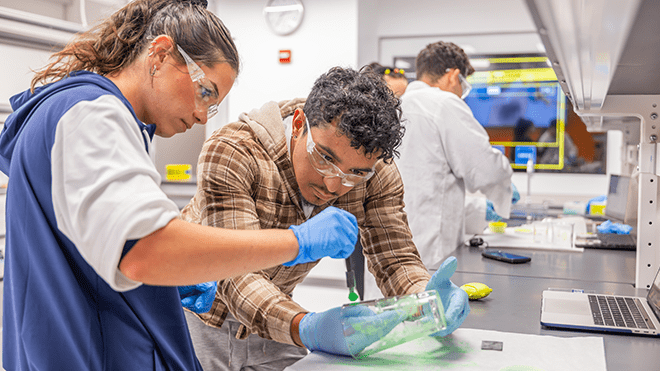 Students working in Roger Williams University's forensics lab.
