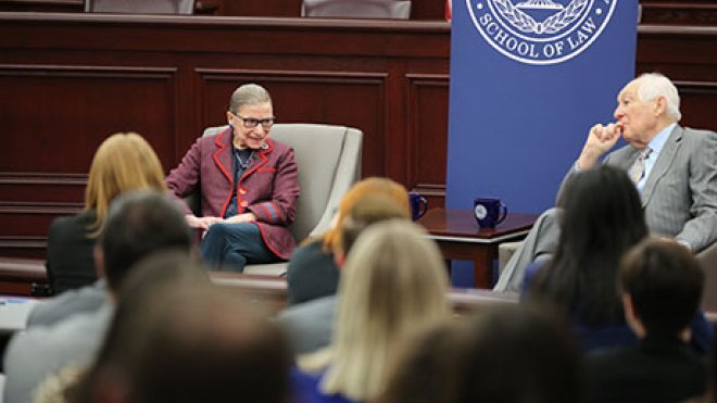 U.S. Supreme Court Justice Ruth Bader Ginsburg talks to 1st U.S. Circuit Court of Appeals Senior Judge Bruce M. Selya