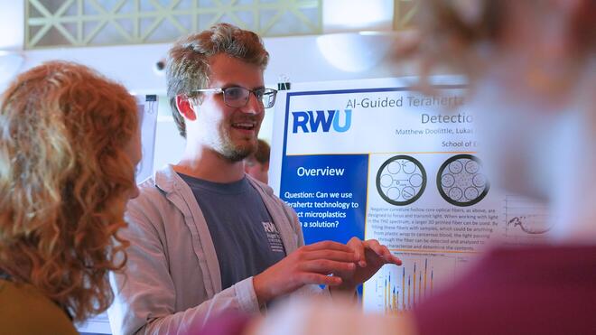 Junior Matthew Doolittle shares his findings with peers and faculty during the Summer Research Showcase.