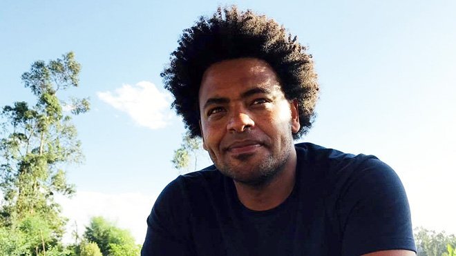 A headshot of Mekbul Tahir who is outside.