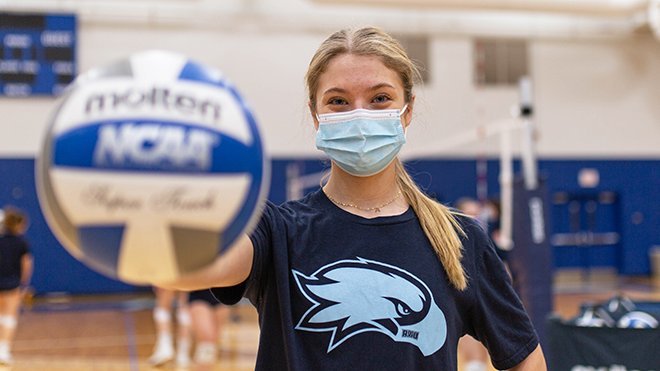 image of Alexandra Welch holding a volleyball at Volleyball Practice
