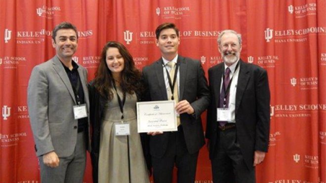 Students pose with award.