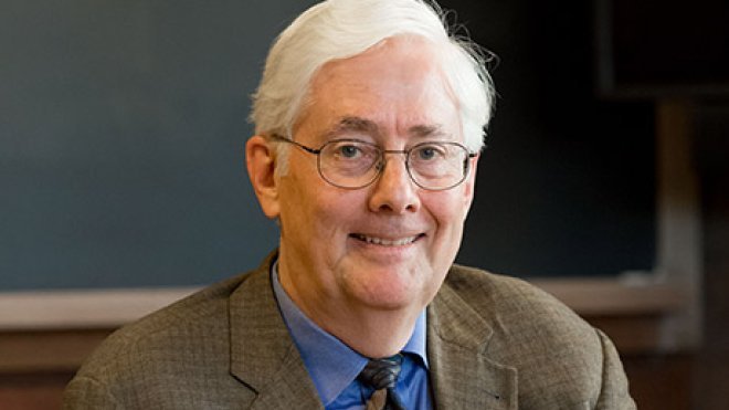 Christopher Achen sitting in a classroom.