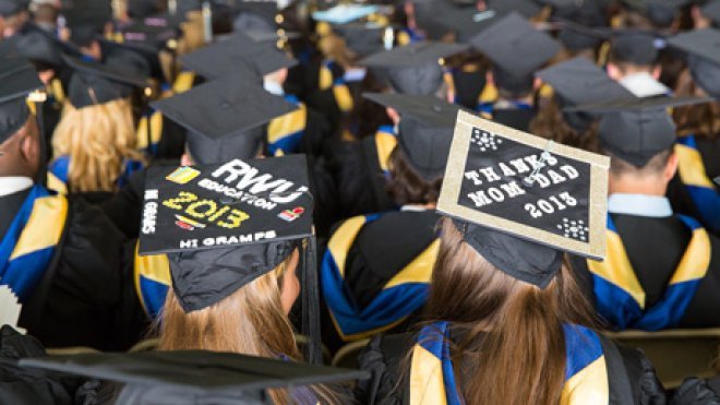 Graduates listen to a speaker