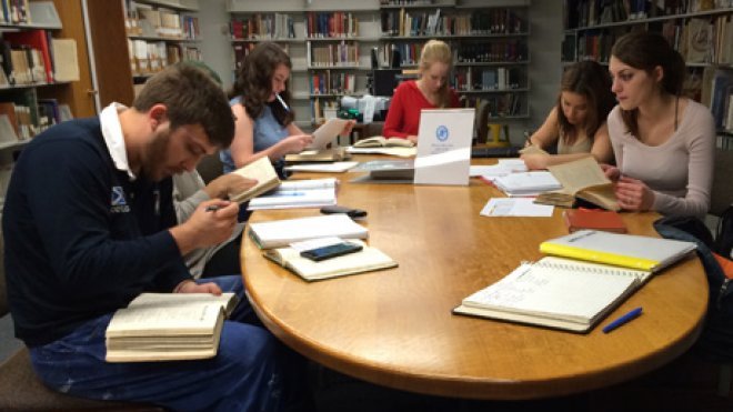 Students research in library archives