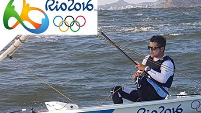 An Olympic athlete navigates his boat.