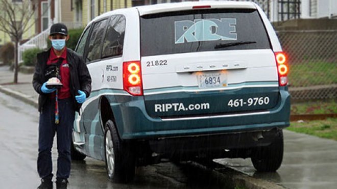 RIPTA driver delivers a meal to a homebound senior.