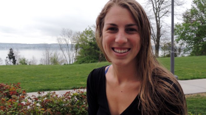 Student sits on university quad