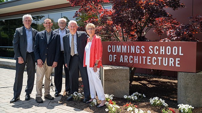 Bill and Joyce Cummings and RWU leaders next to the new Cummings School of Architecture sign