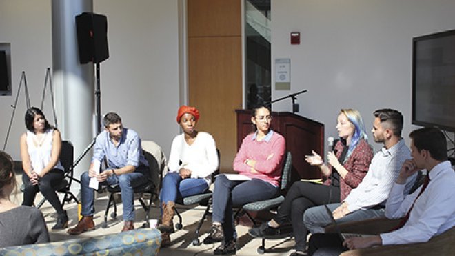 Students talk about social justice issues in a panel discussion.