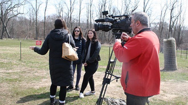 Journalism students learning in the field.