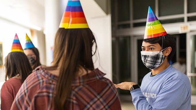 image of InterClass Council Spirit Chair Kyle Villella with another student at a recent 65th Birthday Party for Roger 