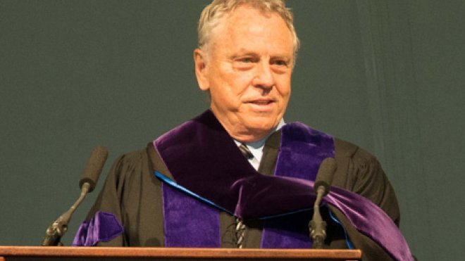 Man speaks at lectern