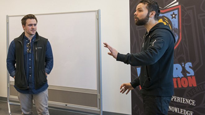 Poet works with student.