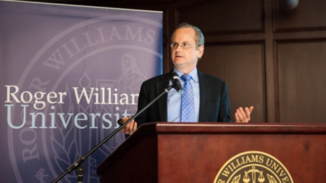 Man speaks to students