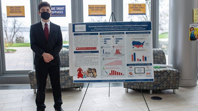 Misha Dubuc with his award winning poster 