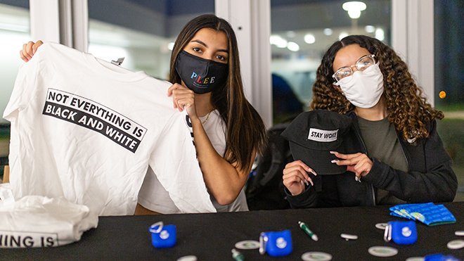 image of MSU President Jeraldyn Ramirez and Public Relations Chair Nathalie Rodriguez tabling during Stay Woke Week