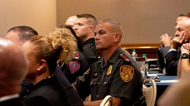 R.I. State Police members listen as the initiative is unveiled.