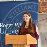 A headshot of Angelina Ferrari giving a speech.