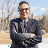 A headshot of Shakour Abuzneid