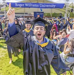 Graduate celebrating at commencement