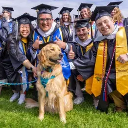 RWU Graduate Students Pose with Roger the First Dog