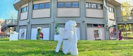 Sculptures by RWU students on lawn in front of muffin