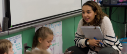 Student teacher works with students in classroom