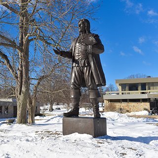 Roger Williams Statue surrounded by snow