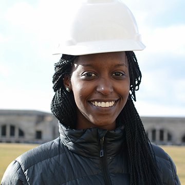 A headshot of Alexia Byusa wearing a hardhat