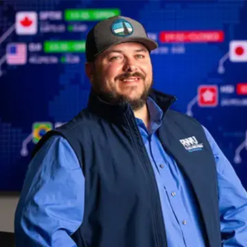 Brian MacDonald stands in one of the labs in the Gabelli School of Business