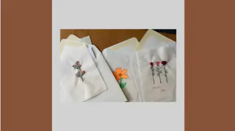 Fabric with colorful stitched flowers