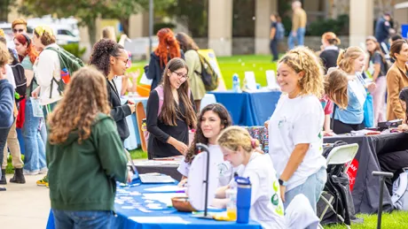 Students engage with campus resources and wellness activities during the Roger Wellness Student Street Fair.