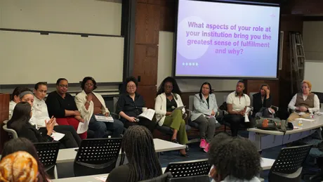Students listening to faculty panel.