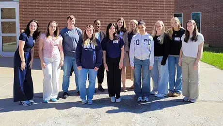 RWU students standing outside of RITS.