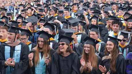 Soon to be graduates take their seats during the Commencement ceremony.