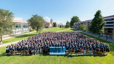 The Class of 2030 gathers for a group photo prior to the Convocation ceremony.