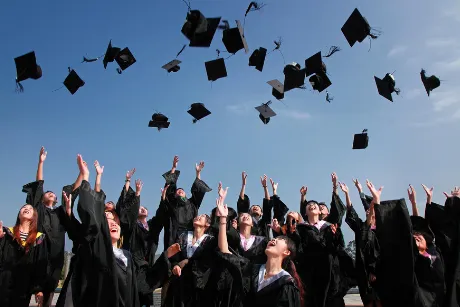 Graduates Tossing Caps