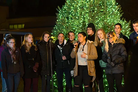 Hawkward members sing during Winter Illumination