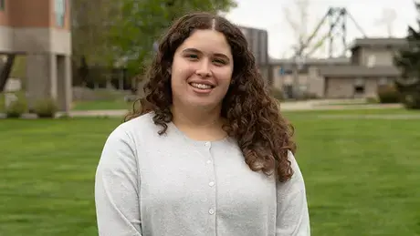 Kaicey Rosa standing in the RWU quad.