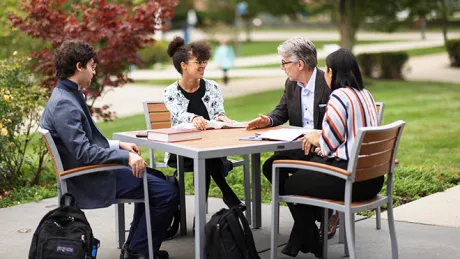 Law School Dean Gregory Bowman sits down with students.