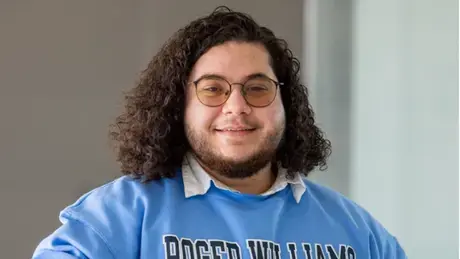 Matthew Milotakis smiling in Global Heritage Hall