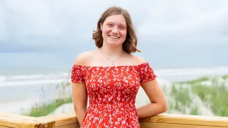 Nina Bodnar smiling at the beach