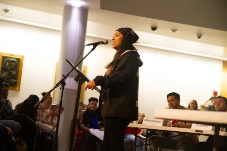 Student performs at microphone.