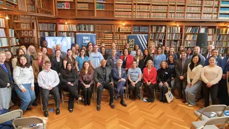 Members of the RWU community and state leaders gather in the Rhode Island State Library during RWU Day of Law and Justice.